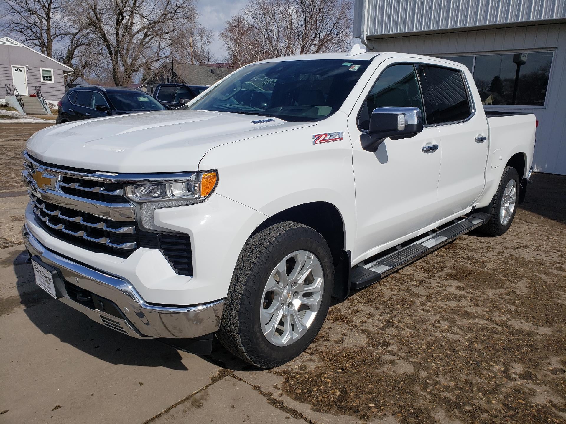 2023 Chevrolet Silverado 1500 Crew Cab Short Box 4-Wheel Drive LTZ in Summit White — front three-quarter view