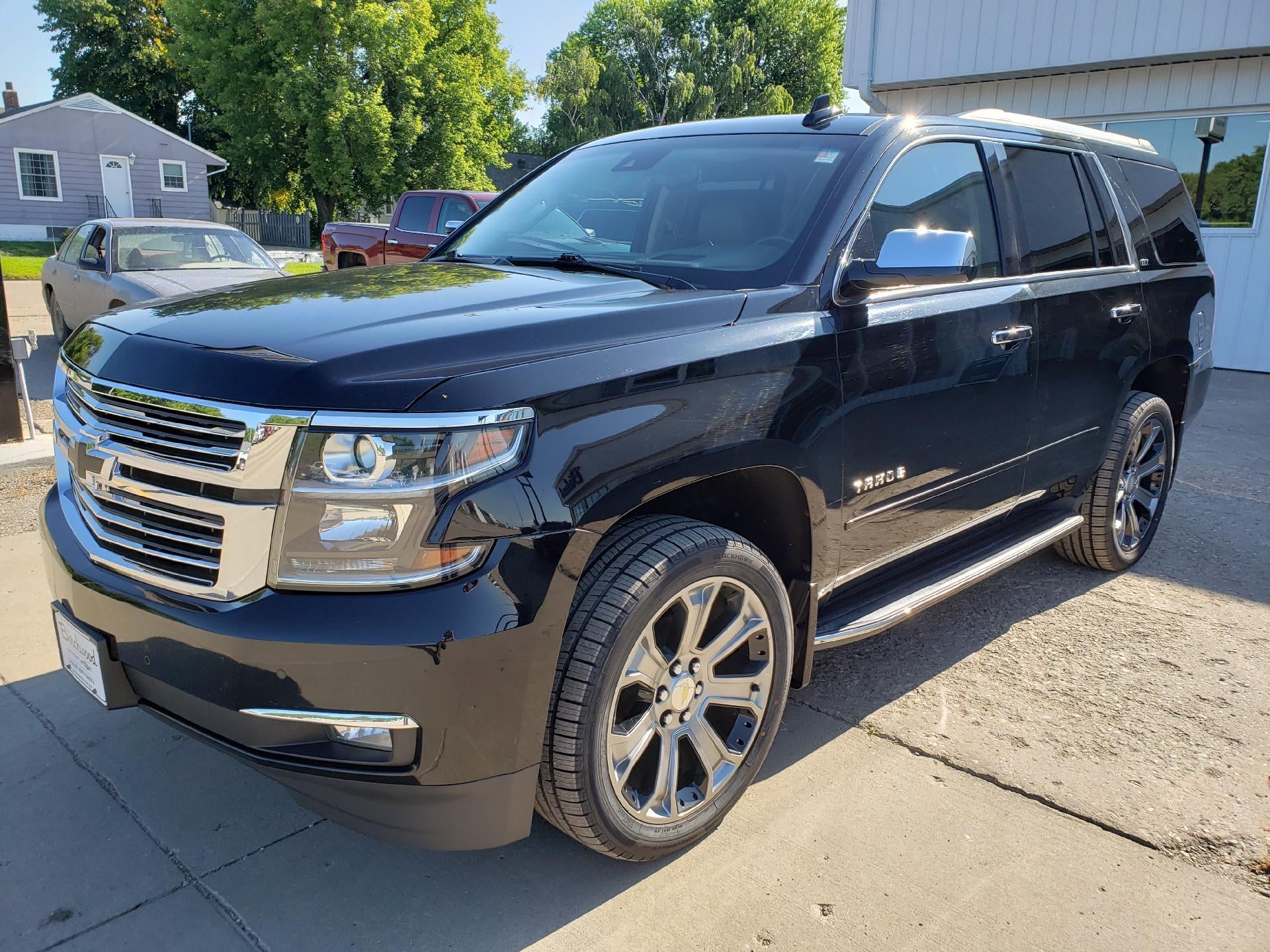 2016 Chevrolet Tahoe 4WD LTZ in Black — front three-quarter view